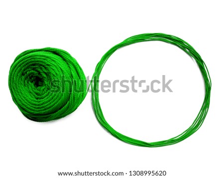 Background of wool yarn, knitted yarn, can also be used as a yarn frame. Green knitting yarn for handicrafts isolated on white background.
