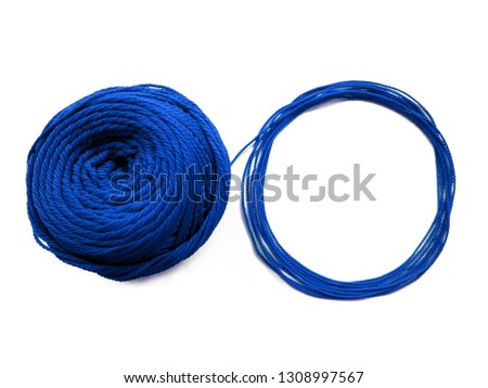 Background of wool yarn, knitted yarn, can also be used as a yarn frame. Blue knitting yarn for handicrafts isolated on white background.