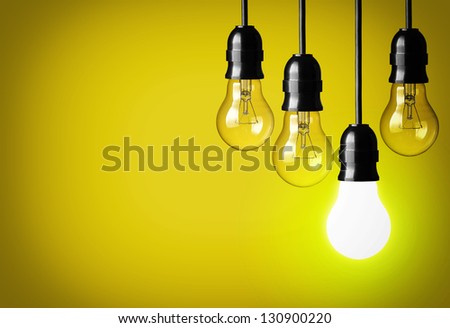 Idea concept on yellow background.