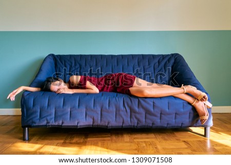 Beautiful woman posing - attractive young woman sleeping on the sofa