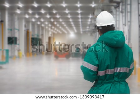 Staff worker control transporting goods in loading of the freezing warehouse. Storage for Ready-made foods or Ready-to-Eat Foods. Export-Import Logistics system concept. Royalty-Free Stock Photo #1309093417