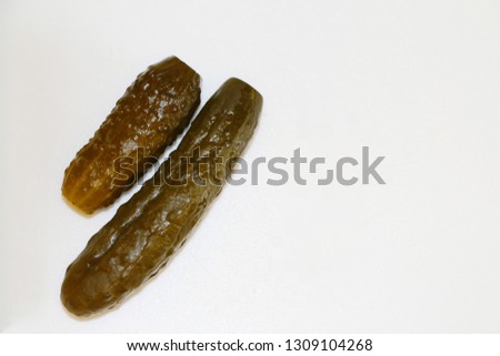 Two pickled cucumbers (commonly known as a pickle or gherkin) isolated on white background and space for your text