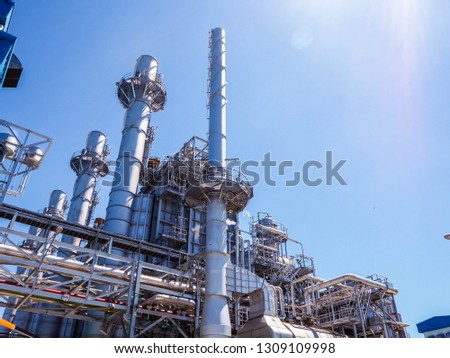 Auxiliary boiler systems from natural gas which include stack, burner, boiler and sky in power plant. Royalty-Free Stock Photo #1309109998