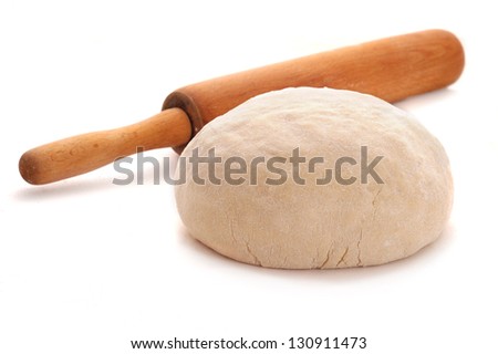ball of dough and rolling pin over white background Royalty-Free Stock Photo #130911473