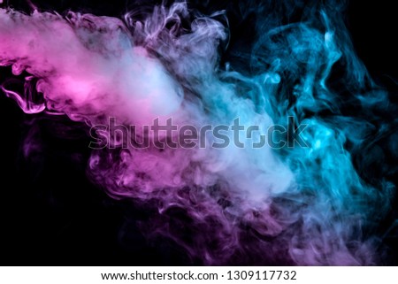 Translucent, thick smoke, illuminated by light against a dark background, divided into three colors: blue, green and purple, burns out, evaporating from a steam of vape for T-shirt print