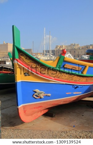 The photo was taken on the pier of the island of Malta. The picture shows the bright nose of a traditional Maltese boat.