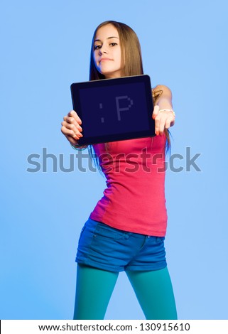 Portrait of colorful emoticon girl holding up tablet computer.