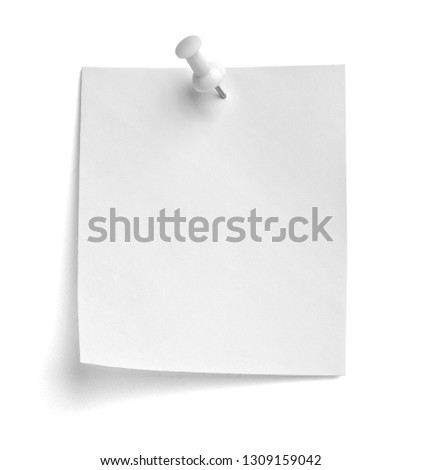 close up of  a note paper with a push pin on white background