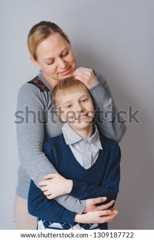 Mother's  love . Mom hugs  son.