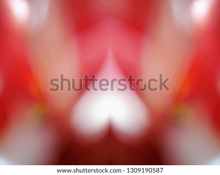 Heart shaped out of focus lights coming from the mother nature with abstract background of Red flower. Good for Valentines Day celebrations. 