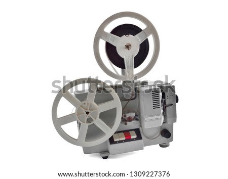 Vintage film projector with Spools isolated on white background. Retro equipment for home cinema, device for displaying motion picture film by projecting it onto a screen