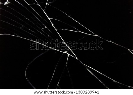 cracks in glass are isolated on a black background