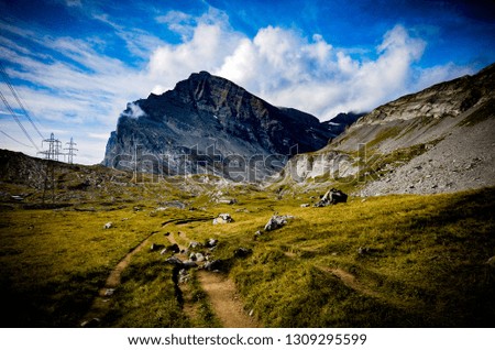 The lanscape in the swiss alps, shot from a hiking trail.