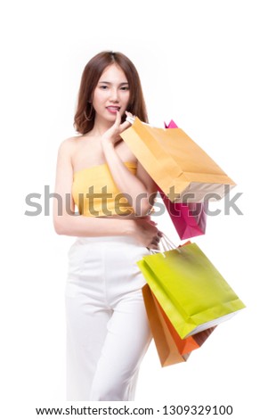 Asian woman holding shopping bags. Beautiful charming woman with many shopping bags brand name product that shop has discount. Pretty girl holds shopping bags isolated on white background. Copy space.
