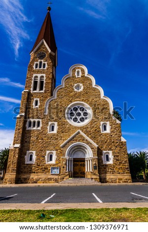 The classic German Lutheran Church of Christ in Windhoek in the setting of palm trees. One of the main attractions of the city.