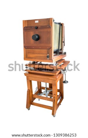 Wooden classic retro camera isolated on white background. Classic retro camera in wooden case isolated on white background