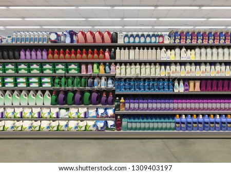 Washing up powder and liquid detergent on shelf In supermarket with colorful and blanco labels. Suitable for presenting new  detergent product and new designs of labels among many others. Royalty-Free Stock Photo #1309403197