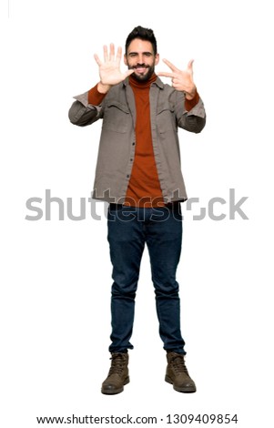 Full-length shot of Handsome man with beard counting eight with fingers on isolated white background