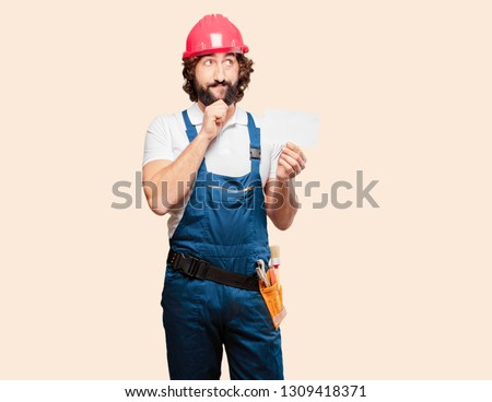 young man worker with a placard