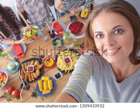 Group of people doing selfie during lunch. Self. Friends. Friends are photographed for eating