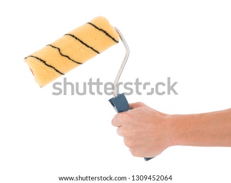 Paint roller isolated over white. New paint roller brush on white background
