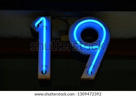 Blue neon sign with number 19