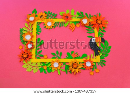 Decorative Arrangement of tropical leaves and flowers. Handmade workshop. Exotic jungle. Pink background.