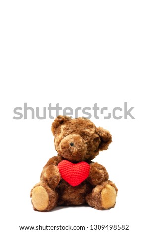 Cute dark brown bear holding wool red heart sitting on white background, give love valentine lover concept.