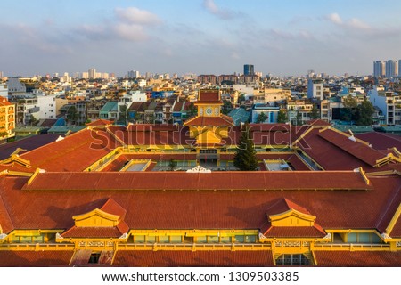 Top view aerial of Binh Tay market (or Cho Lon) and Ho Chi Minh city center with development buildings, transportation, energy power infrastructure. Financial and business centers in developed Vietnam