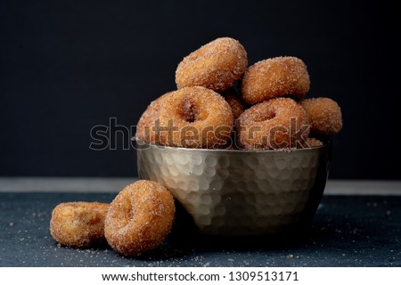 Cinnamon Sugar Mini Donuts Royalty-Free Stock Photo #1309513171