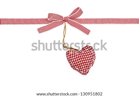 red the white ribbon in a strip, a bow and the checkered heart, isolated on  white background