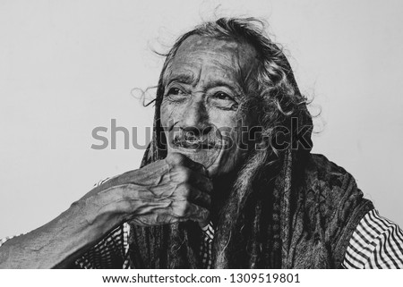 Black and white photo of a man, grandfather with deep facial wrinkles. Royalty-Free Stock Photo #1309519801