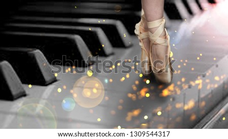 Ballet dancer dances atop a piano with a glitter overlay
