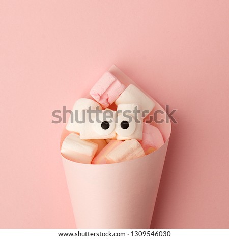 Marshmallows with eyes. Funny kawaii emoji face. Cute cartoon character. Minimal summer flat lay design. Sweet food. Pink background, monochrome concept