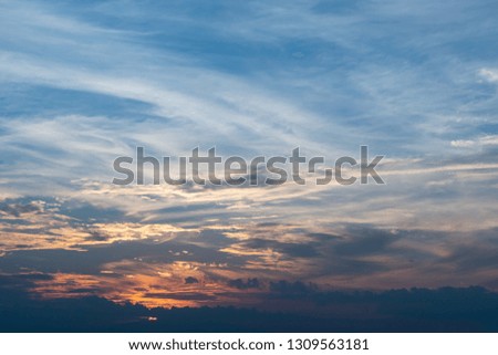 sunlight through cloud on dramatic sunset sky