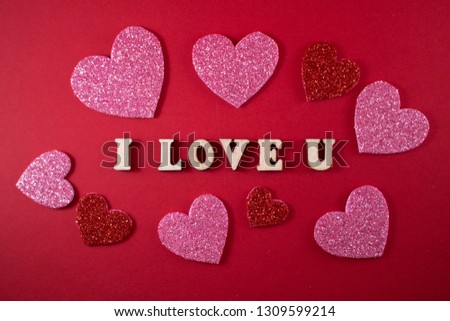 I love you sign and heart symbols in red background for valentine's day celebration.