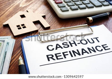 Cash out refinance documents and model of house. Royalty-Free Stock Photo #1309642597