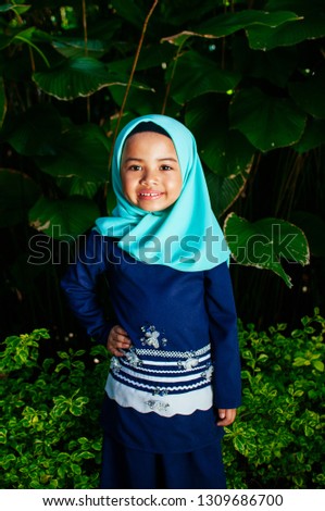 Beautiful Muslim kid girl smiling