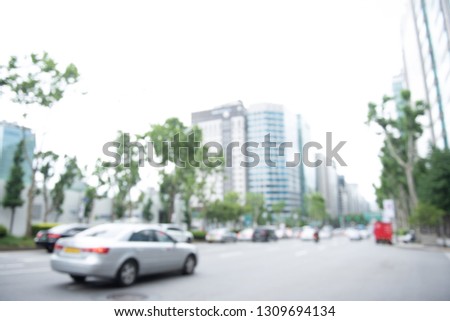 Blurred of bus and cars, traffic on the road in the city in Korea use for the background. Transportation background at day time