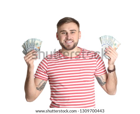 Portrait of young man holding money banknotes on white background
