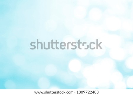 Blurred white light blurring on a bright blue background, reflected light bokeh photos. Decorate blue water-like effects as an abstract background for Summer, card or background.