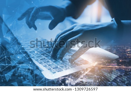 Digital software development, business and technology concept. Double exposure coding programmer, software developer  input data on laptop computer and the city, internet network communication. Royalty-Free Stock Photo #1309726597