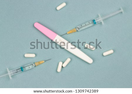 Medical treatment against male or female infertility. With positive pregnancy test Royalty-Free Stock Photo #1309742389