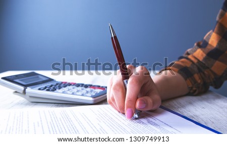 businesswoman calculator documents