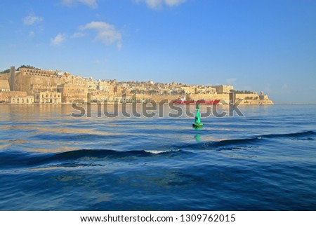 The photo was taken on the island of Malta in the month of January. The picture shows an island bay with the visible city of Valletta.