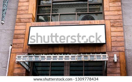 singboard mockup and template blank advertising or light box with copy space for your text message or media and content, signage in dark frame with city wall background display exterior.