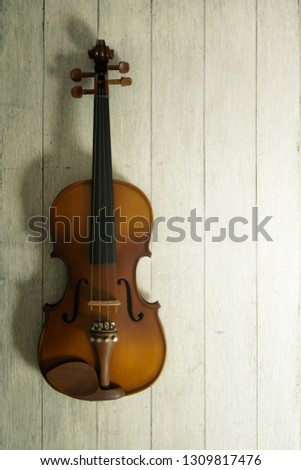 Violin on wood background