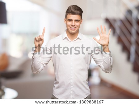 Young business cool man showing number six
