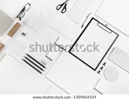 White stationery set. Template for branding identity on wooden background. For graphic designers portfolios. Flat lay.