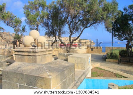 The photo was taken in the month of January on the island of Malta. The picture shows a public park in the city of Singlea.